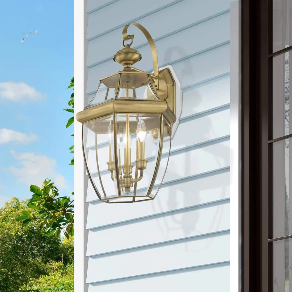 Monterey 3-Light Antique Brass Hardwired Outdoor Wall Lantern Sconce by Livex Lighting 3 Monterey 3-Light Antique Brass Hardwired Outdoor Wall Lantern Sconce by Livex Lighting - Image 3