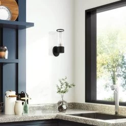 Banca 1-Light Black ADA Wall Sconce with Clear Glass by Livex Lighting -Livex Lighting shop black livex lighting vanity lighting 17281 04 76 1000
